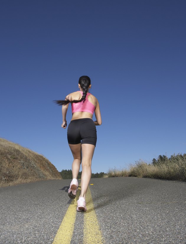 Woman running in the middle of the road