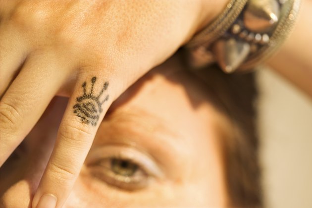 Woman with tattoo on her hand