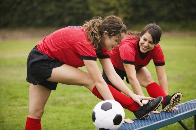 Women in athletic attire stretching