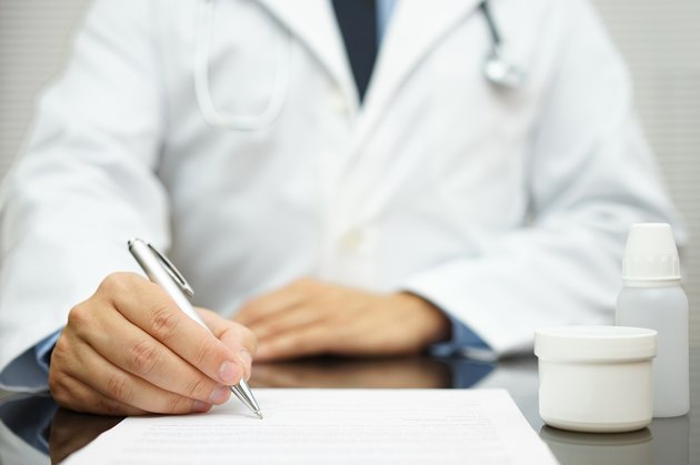 Doctor writes prescription