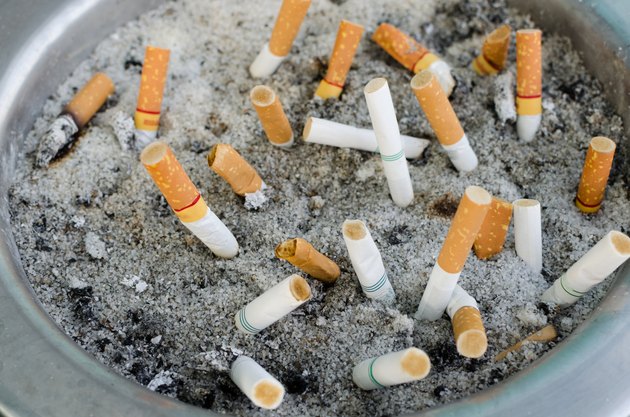 smoked cigarettes in a dirty ashtray