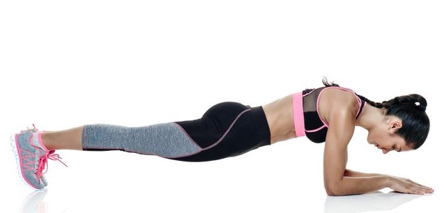 one mixed raced woman exercising fitness exercises isolated on white background