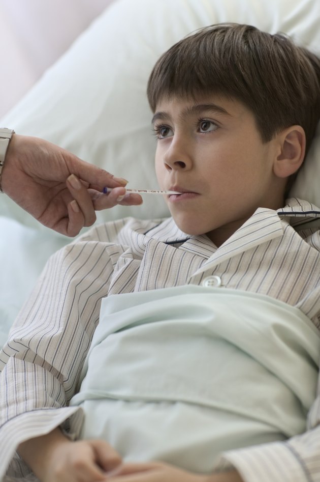 Boy with a thermometer in his mouth