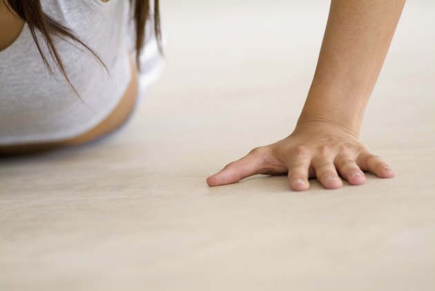 Person doing push-ups, part of, close-up