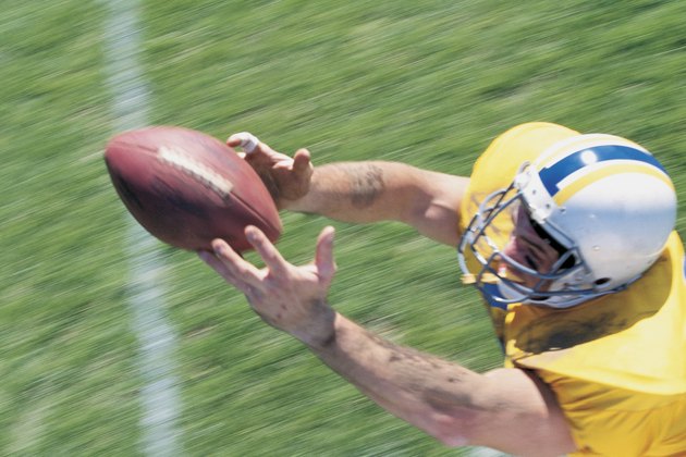 Receiver catching football