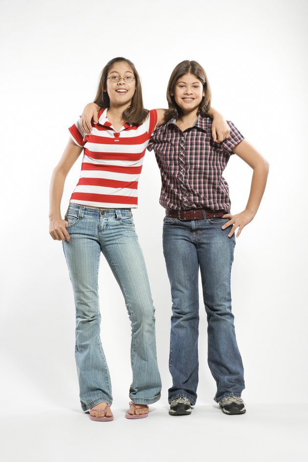 Teen sisters posing together