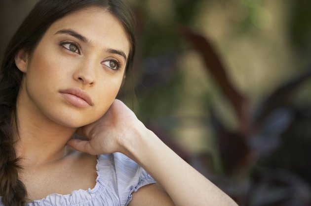 Young woman looking away, close-up