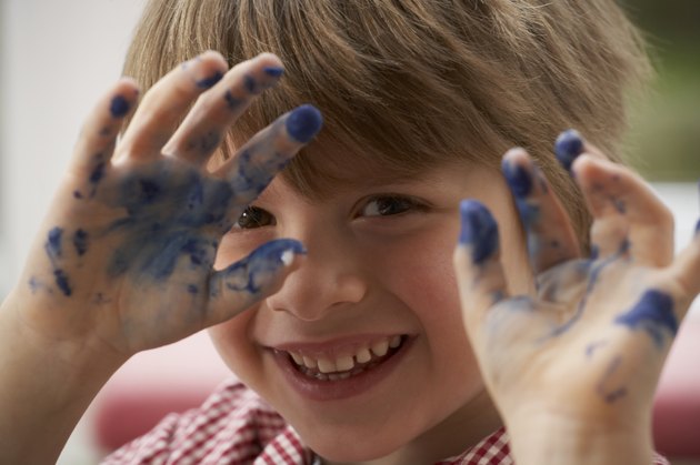 Boy with paint on his hands