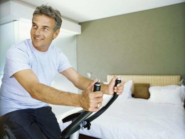 Senior man exercising with a exercising bicycle