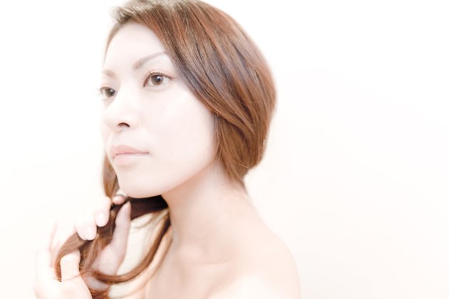 Side View of Young Woman, Holding Her Hair
