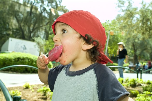 boy licking a popsicle