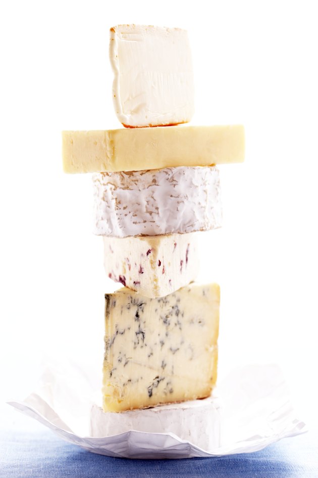 Stack of assorted of cheeses, close-up