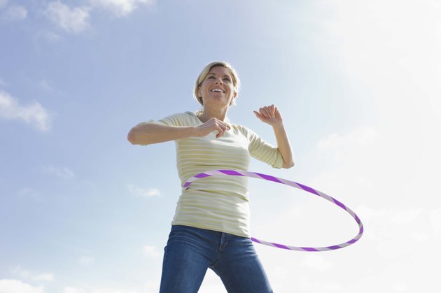 Woman with a plastic hoop toy