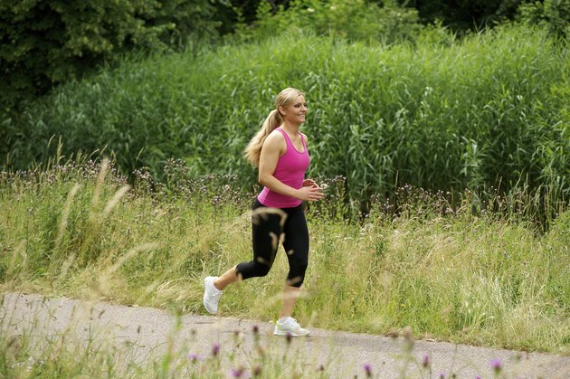 Healthy young woman exercising outdoors