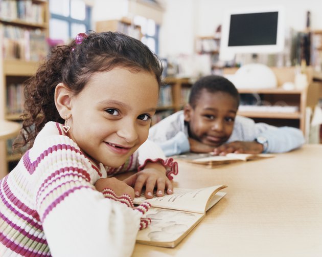 Young Children Reading Books in a Classroom