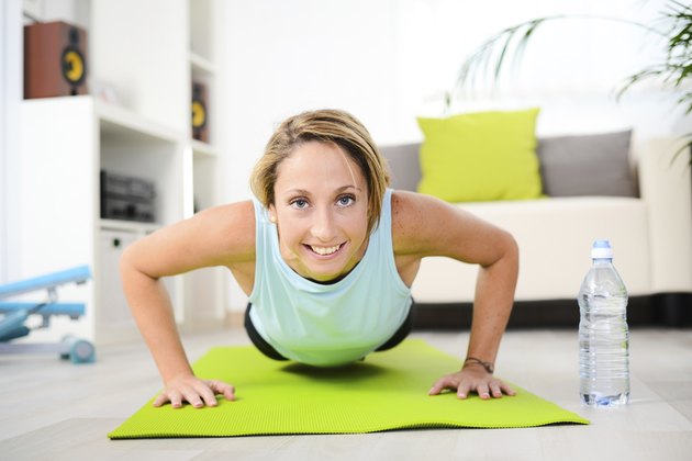 attractive and healthy young woman doing fitness exercises workout home