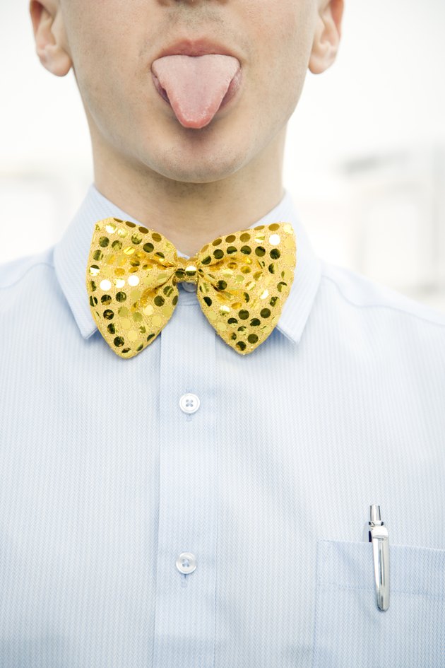 Man Wearing Bow Tie and Sticking Out Tongue