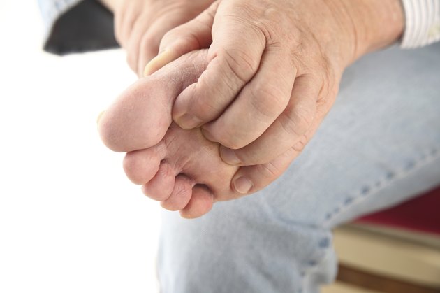 scratching bottom of foot