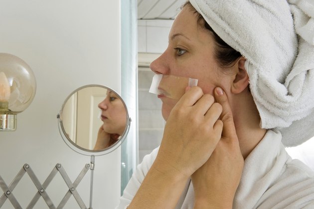 Depilating her moustache