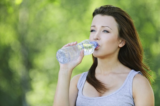 young woman drinking water