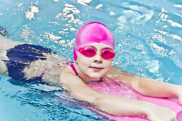 Cute girl in swimming pool