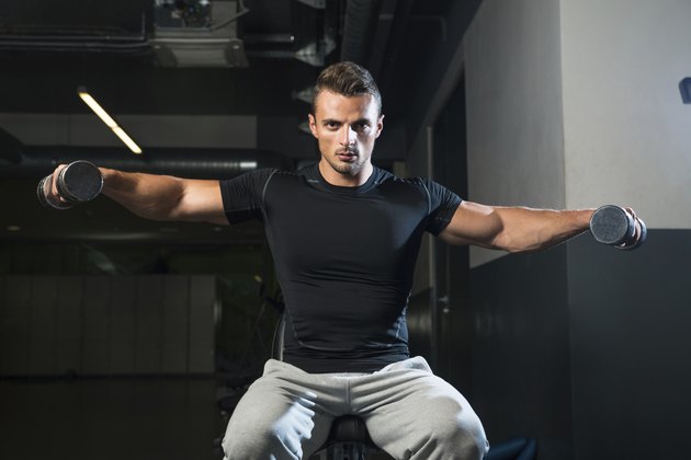 Bodybuilder Doing Exercise For Shoulder