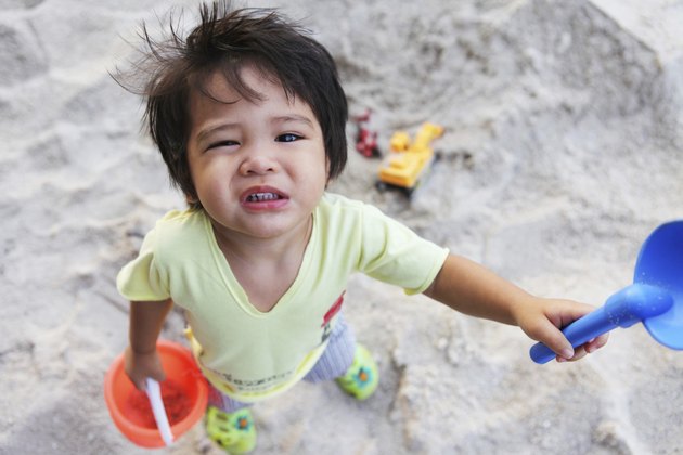 little boy in the sandpit