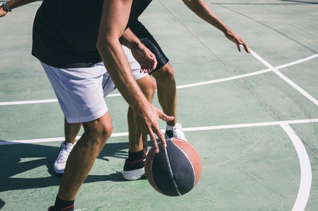 Men playing basketball
