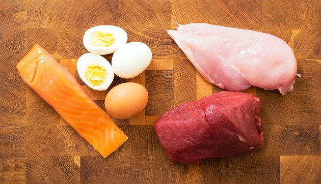 Meet, fish, eggs on kitchen table