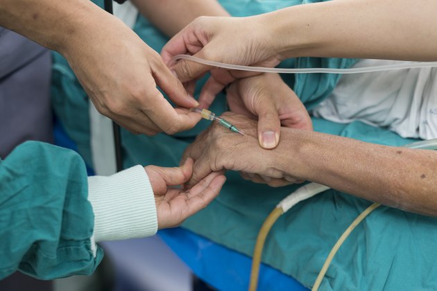anesthesiologist doctor open intravenous fluid