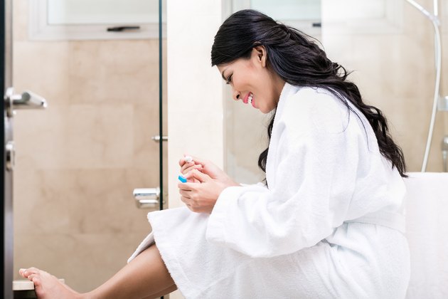 Asian woman being joyfully pregnant