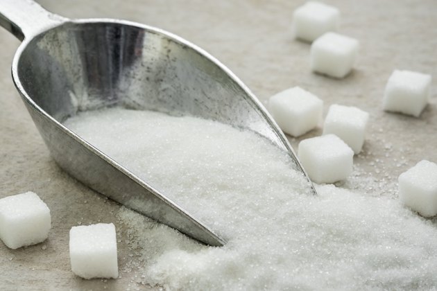Sugar on metal scoop