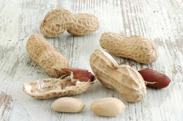 Peanuts on old wooden table