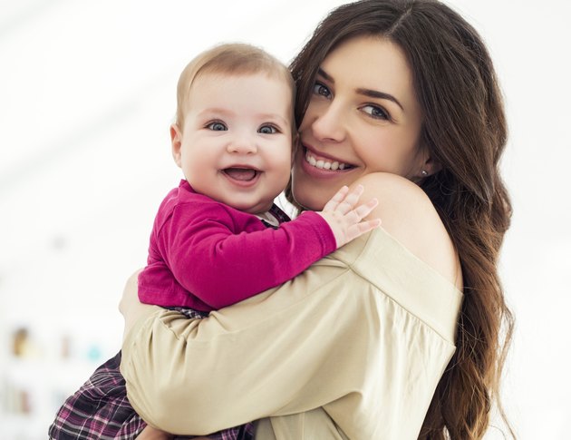 Mother Holding Baby Girl