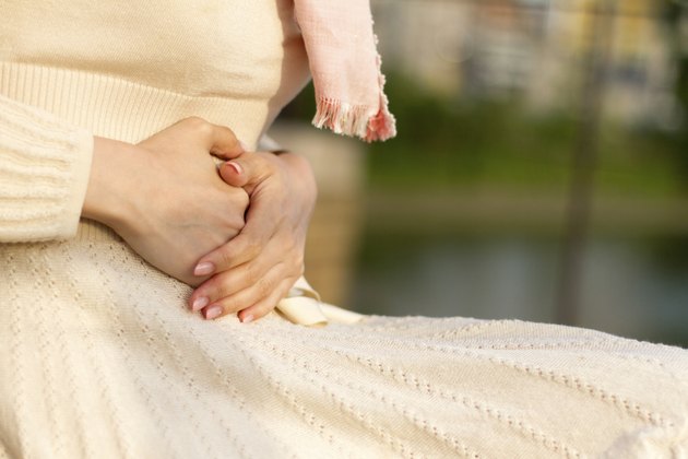 Woman Holding Her Stomach