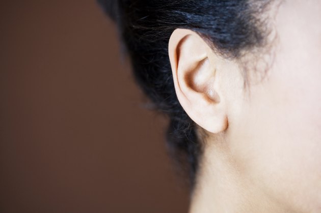 Close-up side view of womans head showing ear and jawline