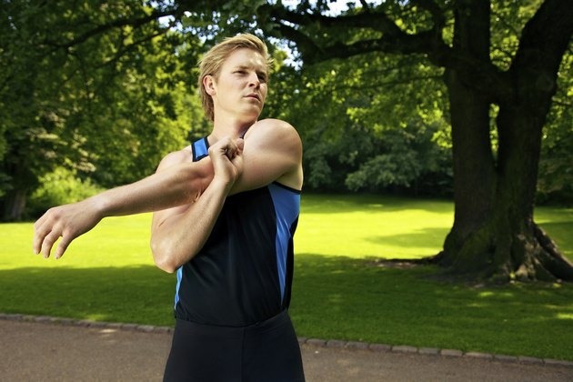 Athlete Warming Up by Stretching