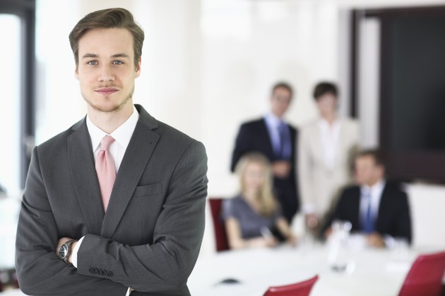 Businessman in meeting room, portrait
