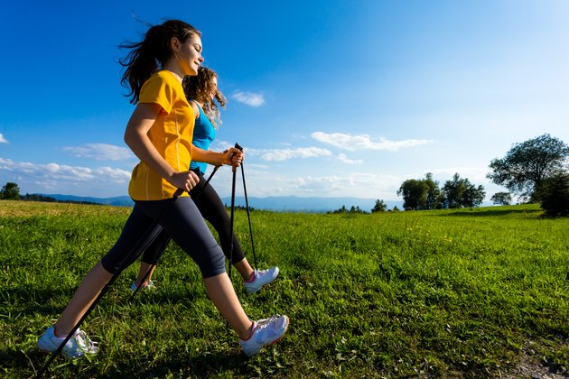 Healthy lifestyle - young women Nordic walking