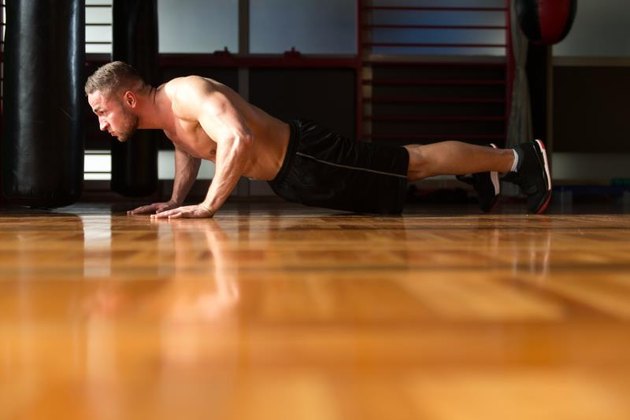 Young Adult Athlete Doing Push Ups As Part Of Bodybuilding Training