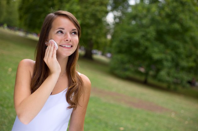 Smile woman remove makeup