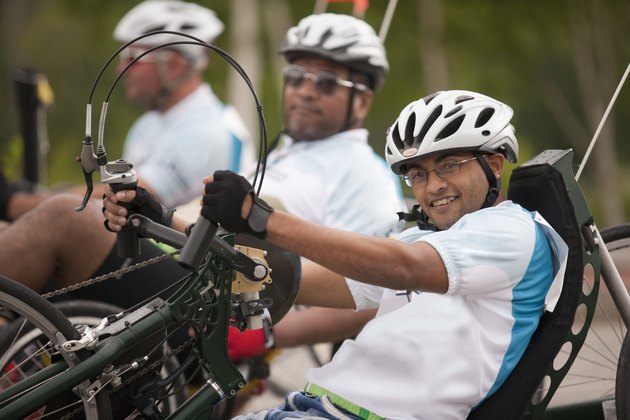Veterans with spinal cord injuries participating in a tricycle race