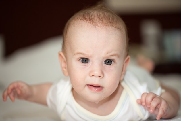 Drooling baby with artful face