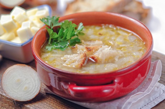French onion soup in a red bowl