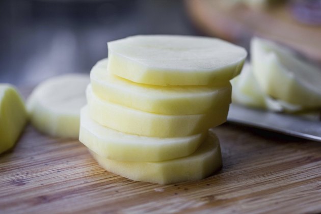 Stack of sliced purified potatoes, cooking delicious dishes