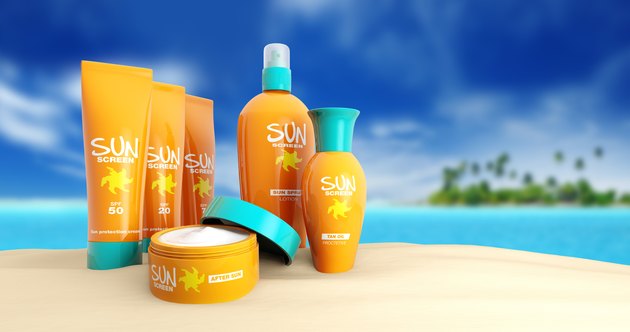 set of sun cream in a tropical beach