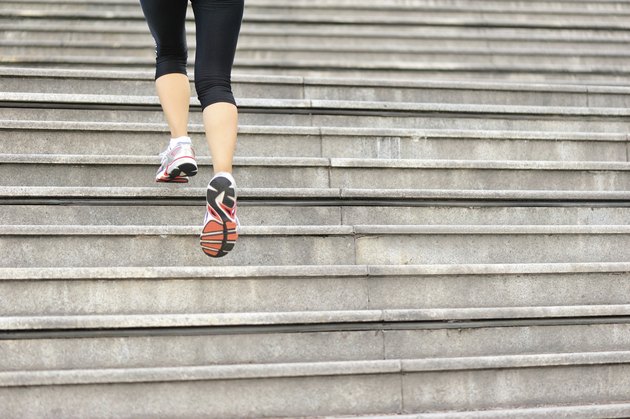 Runner athlete running on stairs.