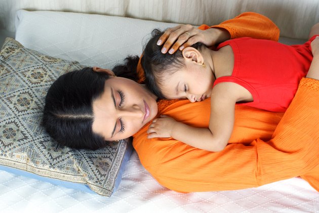 Top angle view of a mother and child sleepping