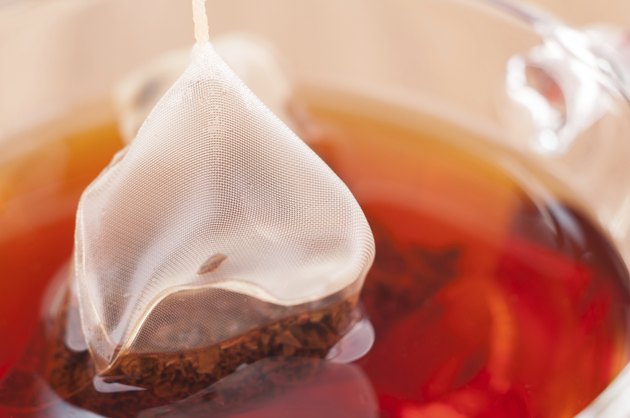 Pyramid mesh tea bag in a cup extreme close-up