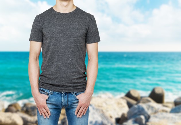 Close-up of a man in a blank grey t-shirt.